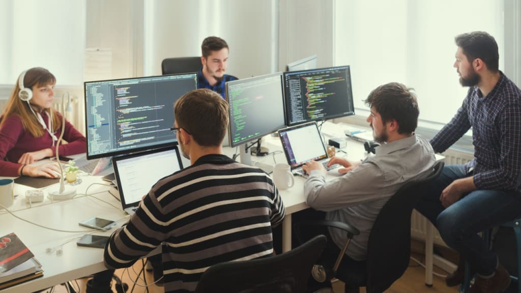 A magnifying glass over a blueprint, symbolizing quality inspection